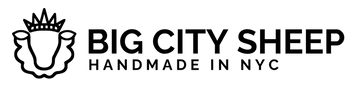 Black logo text reading 'BIG CITY SHEEP' with 'HANDMADE IN NYC' underneath, alongside a stylized sheep outline with a crown, on a white background.